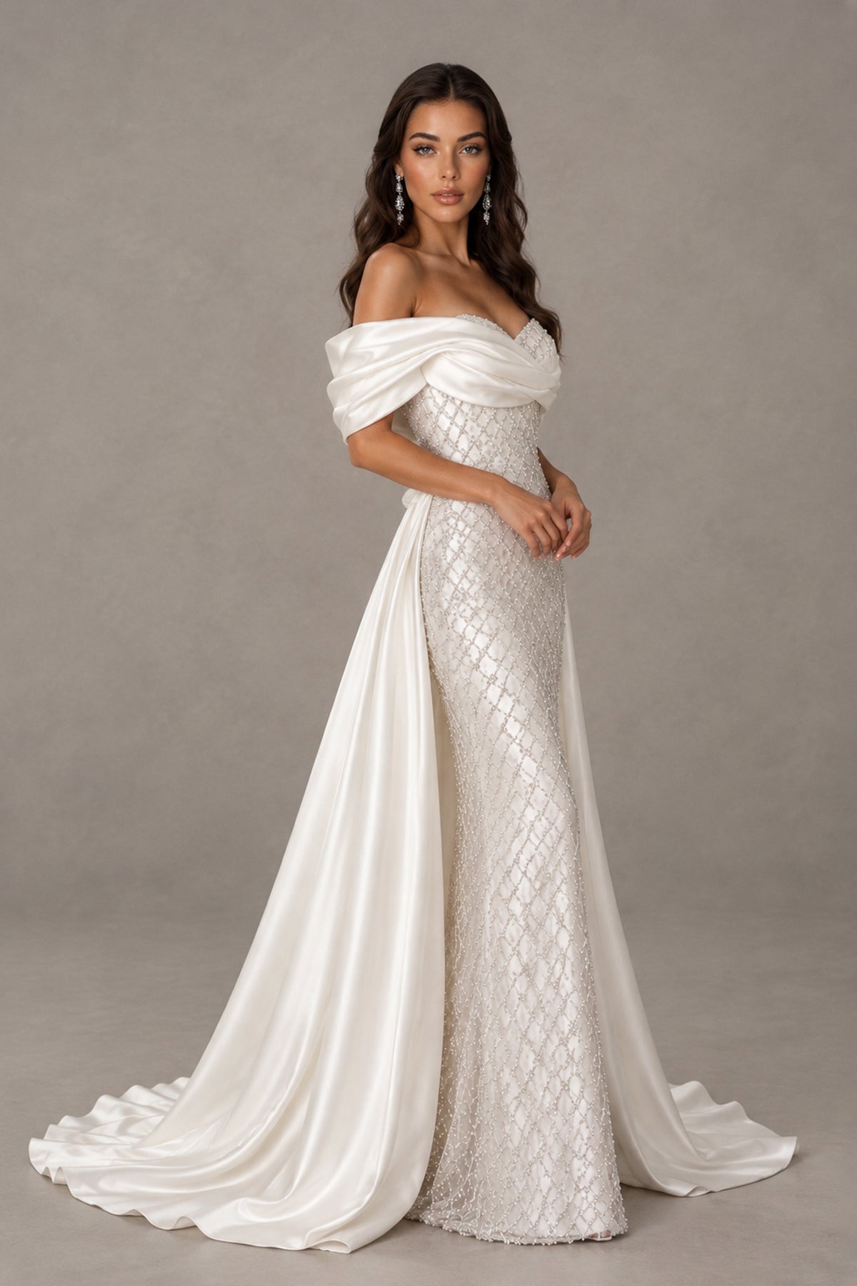 BOLODOO QQ056 ivory evening gown three-quarter view showing textured fabric and flowing side draping
