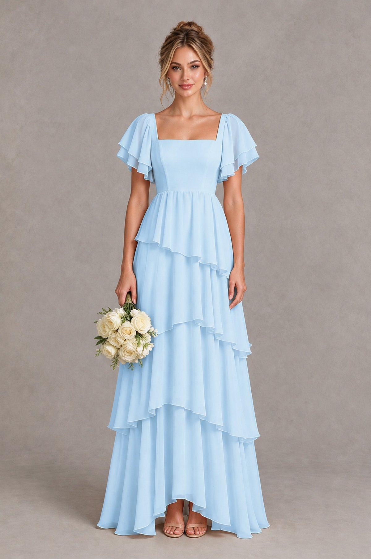 Light blue flutter sleeve tiered chiffon maxi bridesmaid dress, model holding a white wedding bouquet