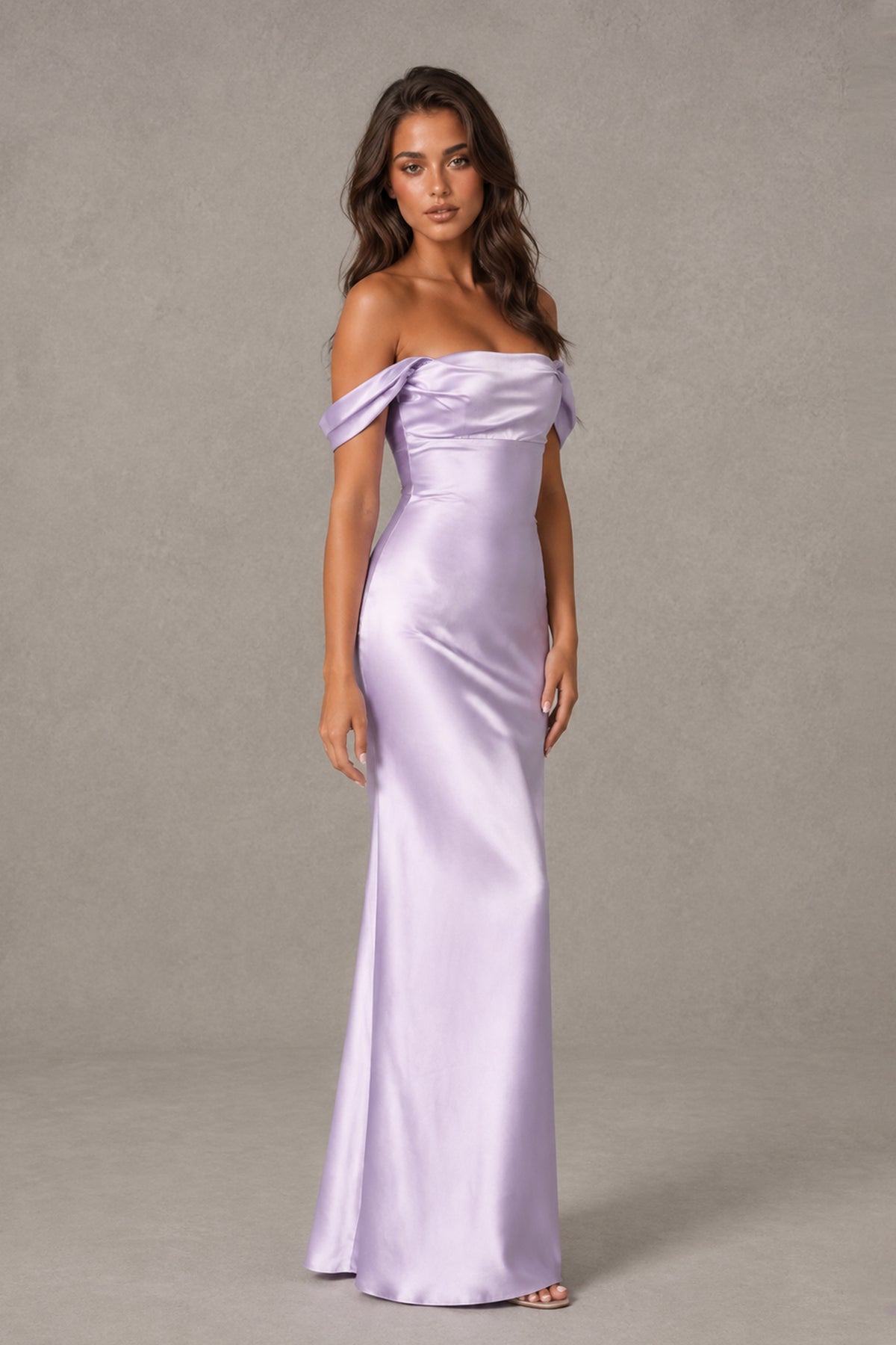 Side view showing the fitted silhouette and draped sleeves of the lilac floor-length gown