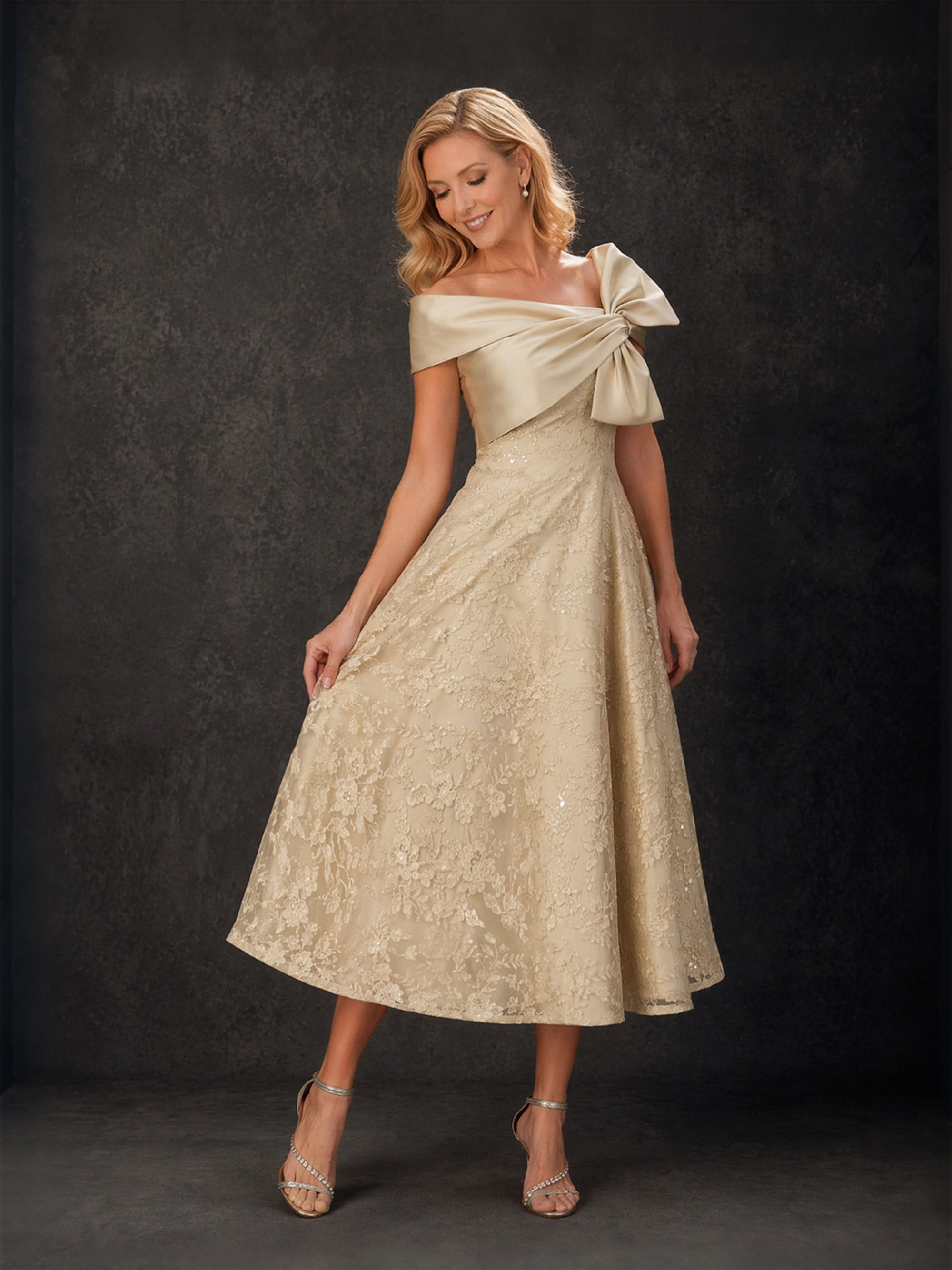 BOLODOO champagne gold lace off-shoulder bow tea-length dress - front full body view with gold heels