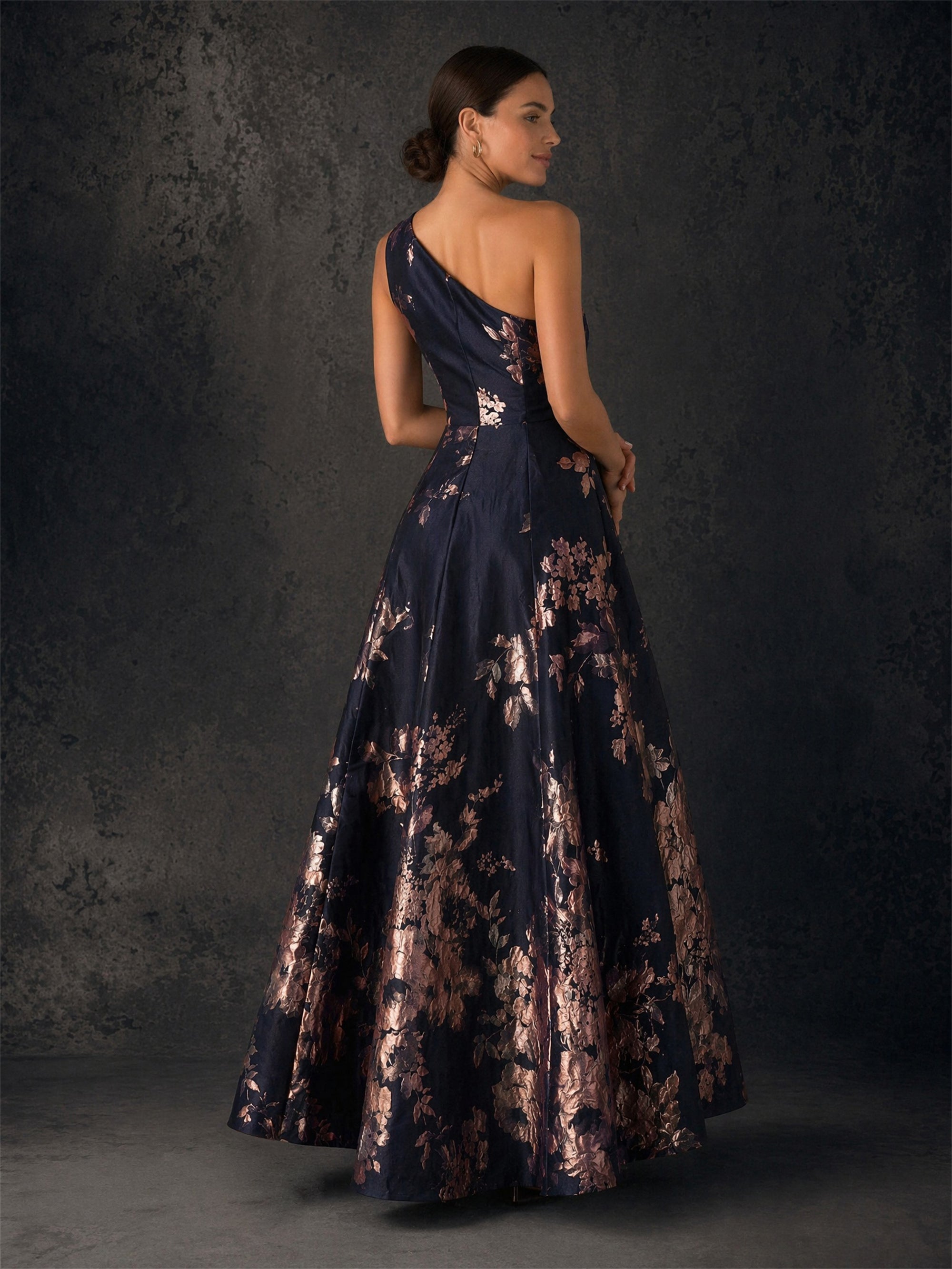 BOLODOO navy rose gold floral jacquard one-shoulder gown - back view showing open back and voluminous floor-length skirt