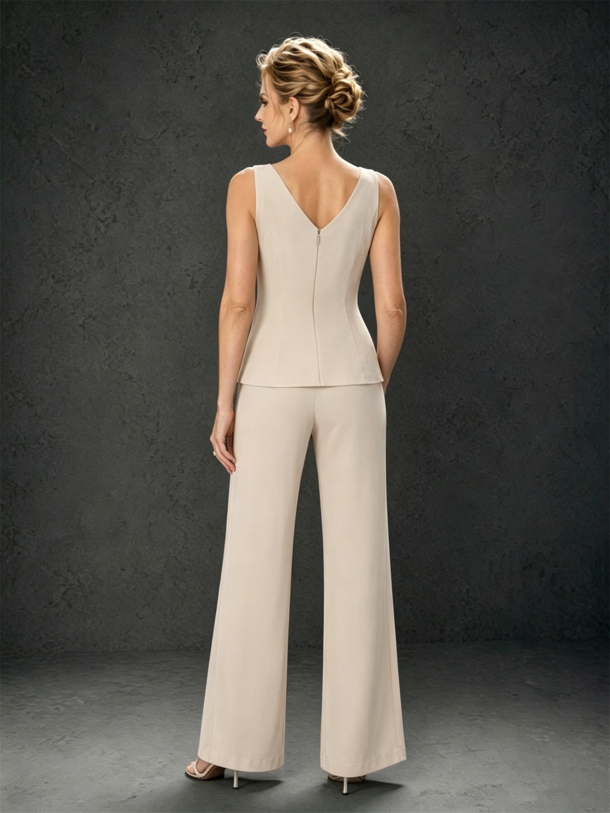 BOLODOO champagne mother of the bride pant suit - three-quarter view with chiffon jacket and silver clutch