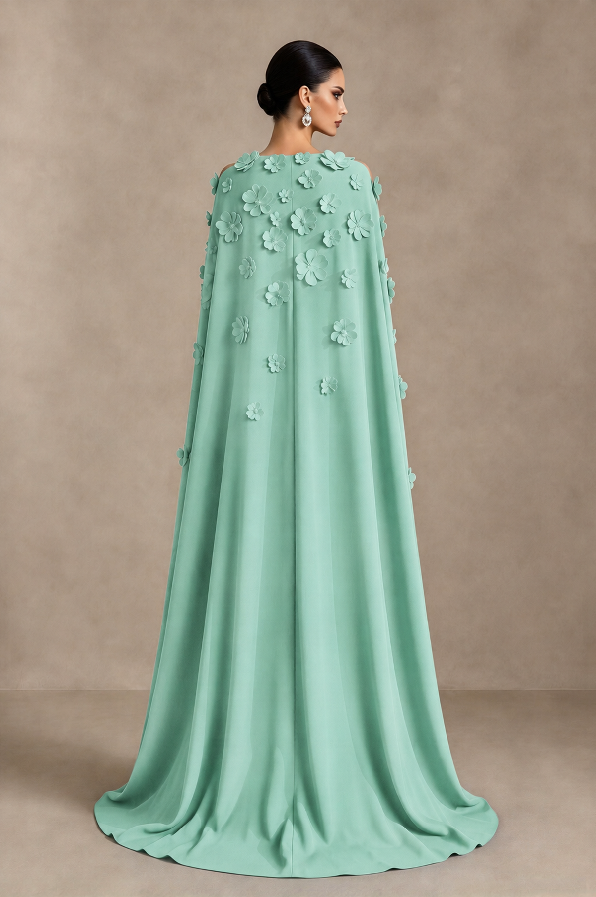Mint green floral evening gown back view showing flowing full-length cape overlay