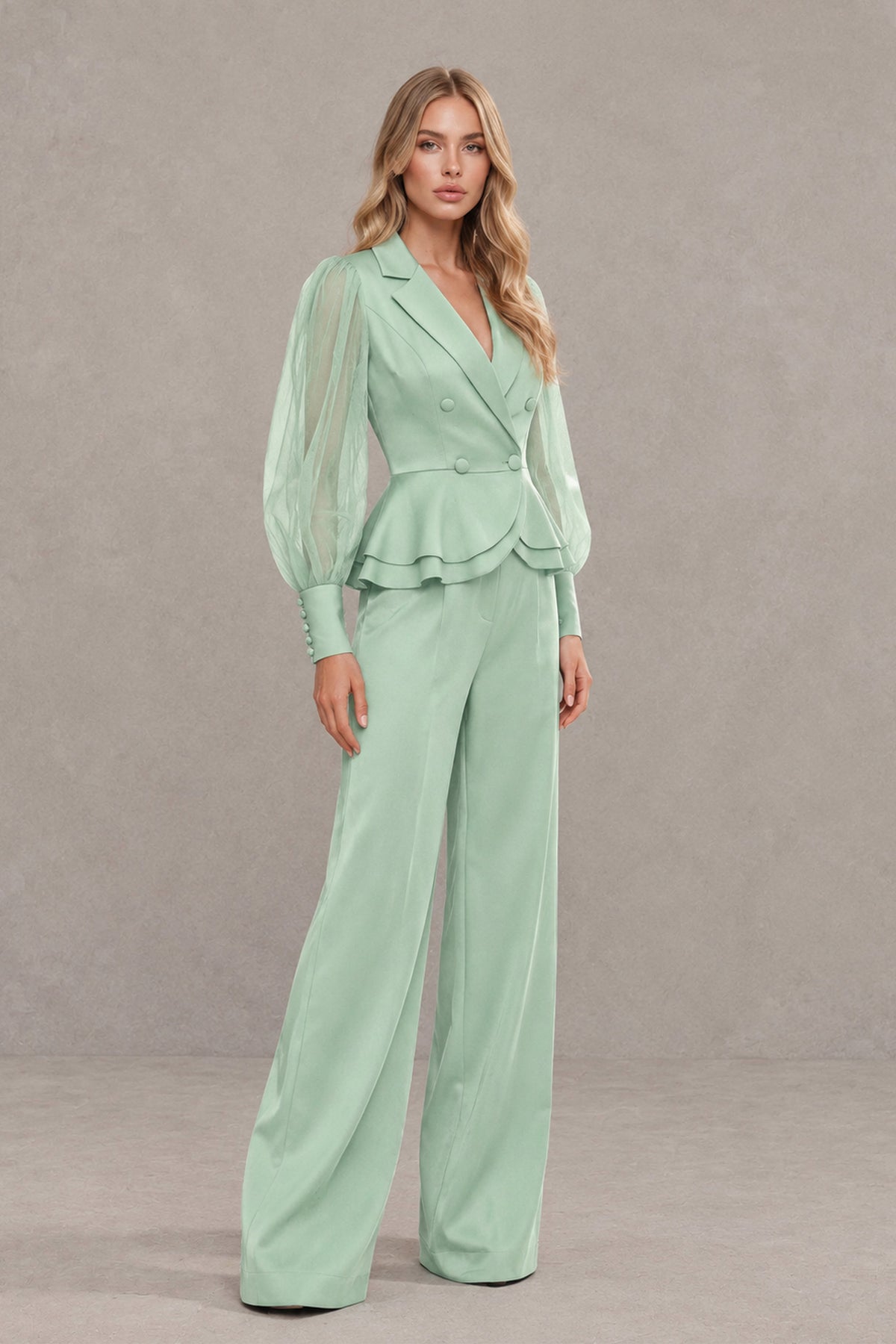 Model walking in BOLODOO mint green peplum pantsuit set