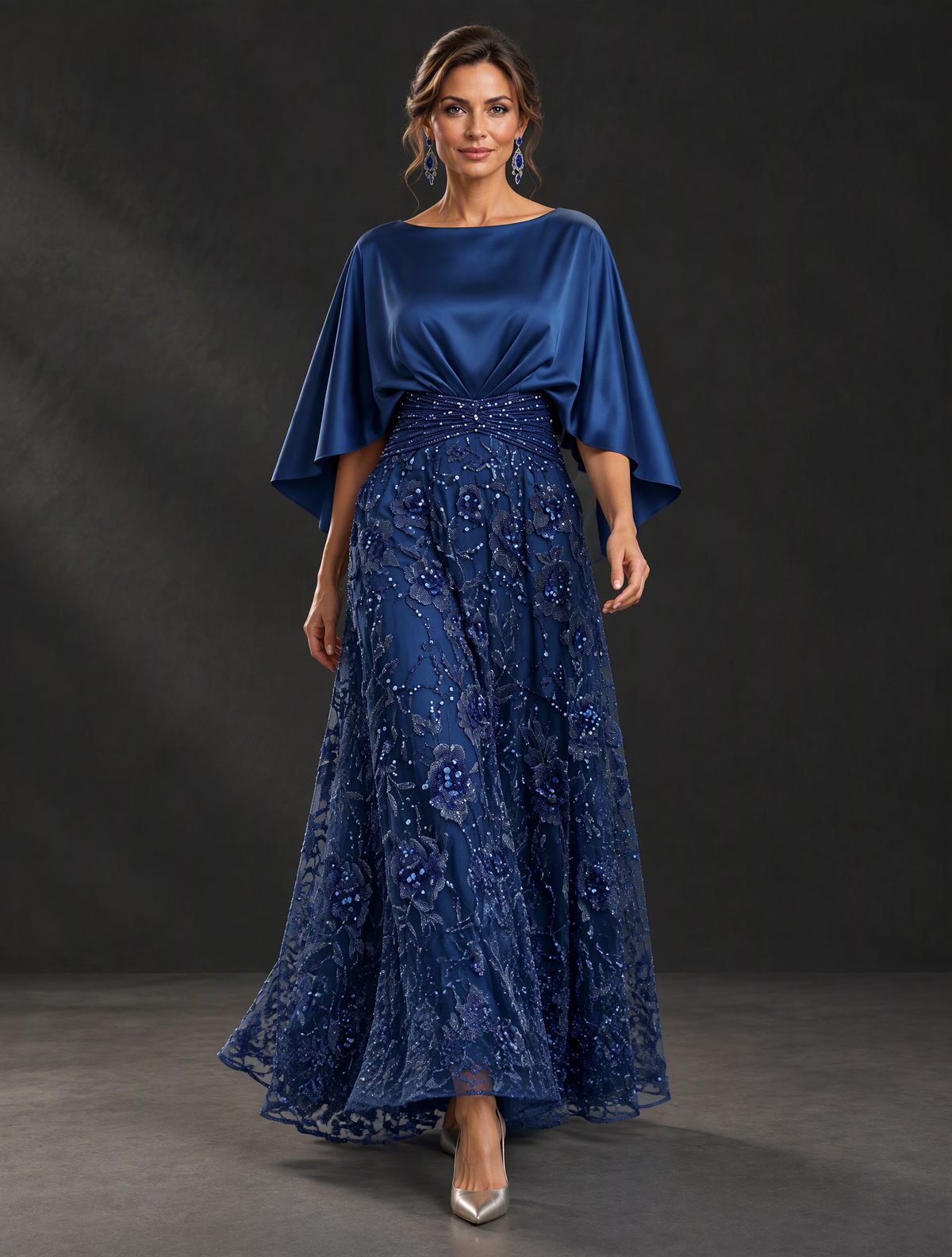 BOLODOO navy blue cape sleeve mother of the bride dress showing flowing A-line floral skirt in motion, walking front view
