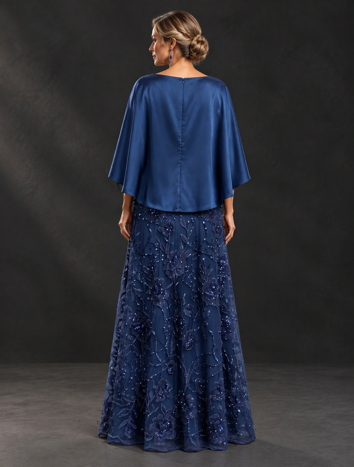 BOLODOO XX088 navy blue mother of the bride dress showing covered cape-style back, center zipper and floral skirt, rear view