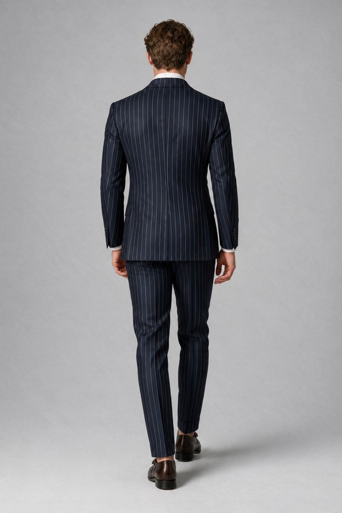 BOLODOO navy blue pinstripe suit jacket and matching trousers, front walking view