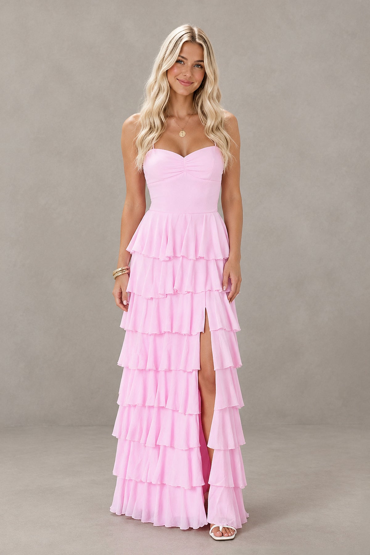 Back view of pink tiered maxi dress with open lace-up back