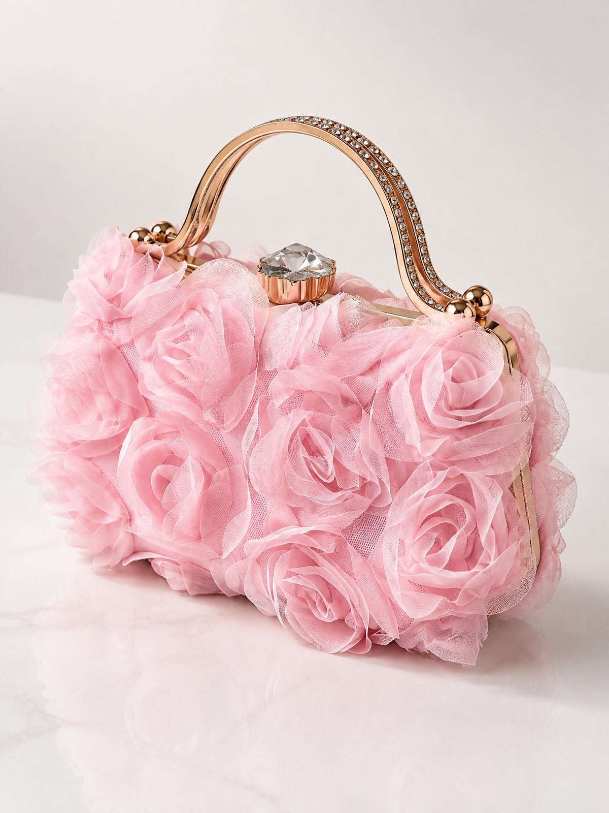 Angled view of BOLODOO pink floral evening handbag with raised fabric roses