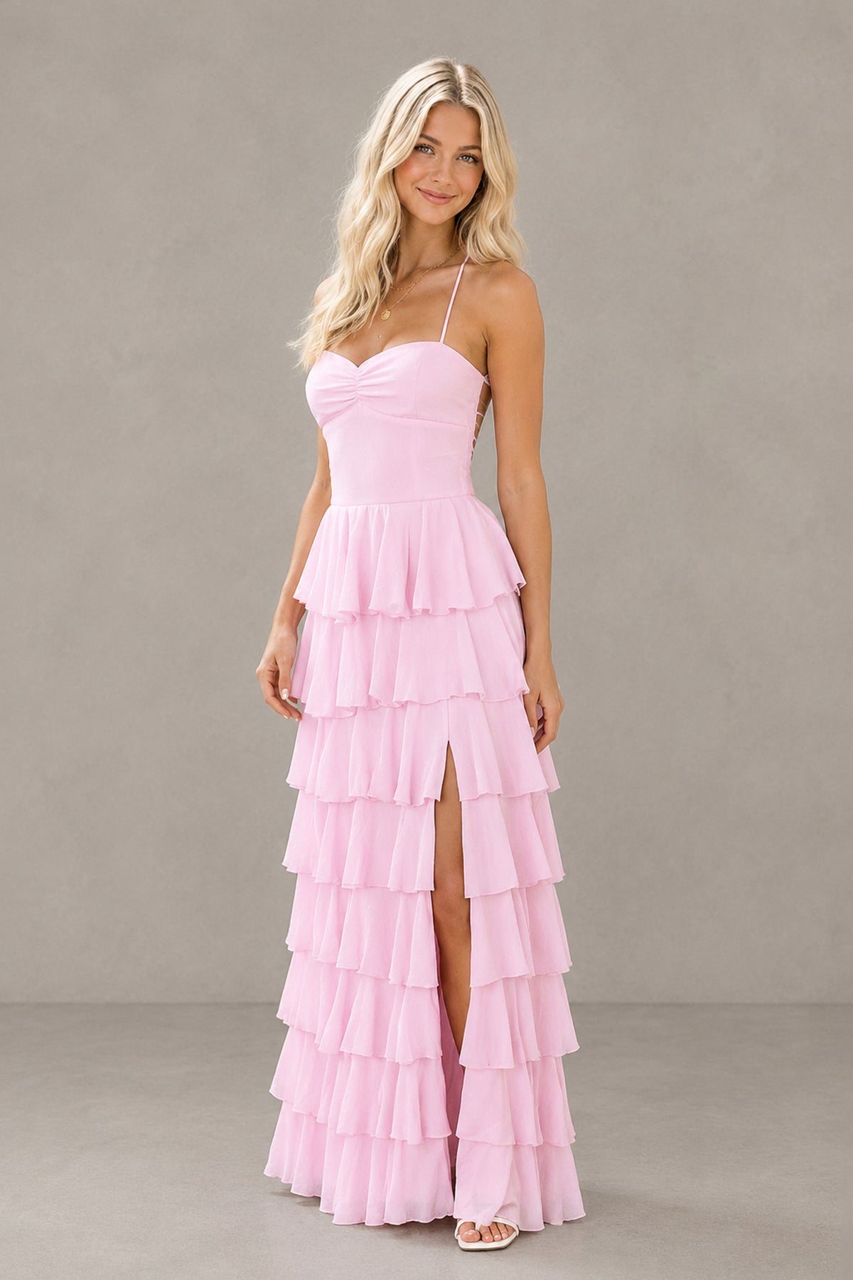 Pink tiered ruffle formal maxi dress showing front slit and sweetheart neckline