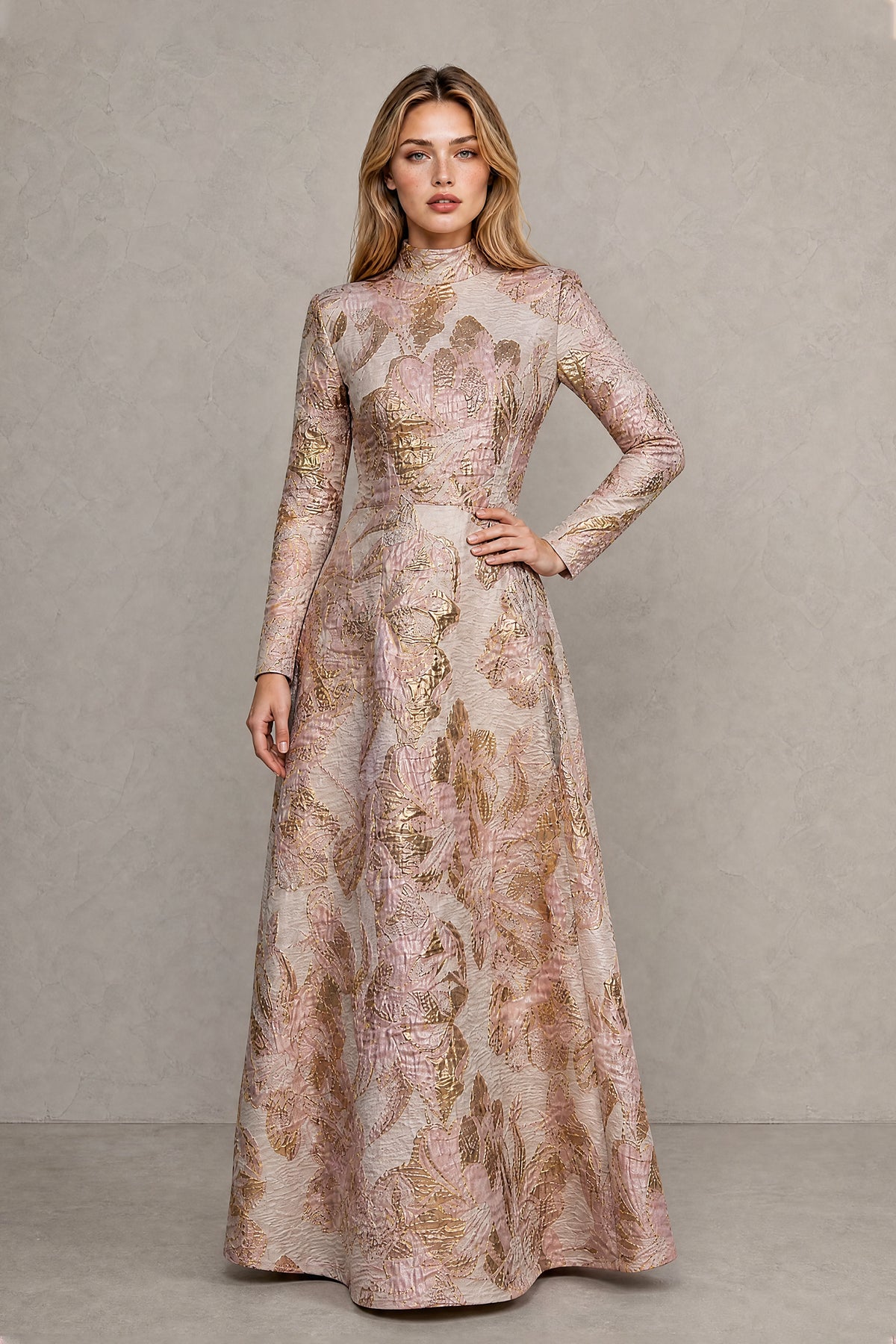 BOLODOO rose gold floral jacquard evening gown three quarter view with hand on hip