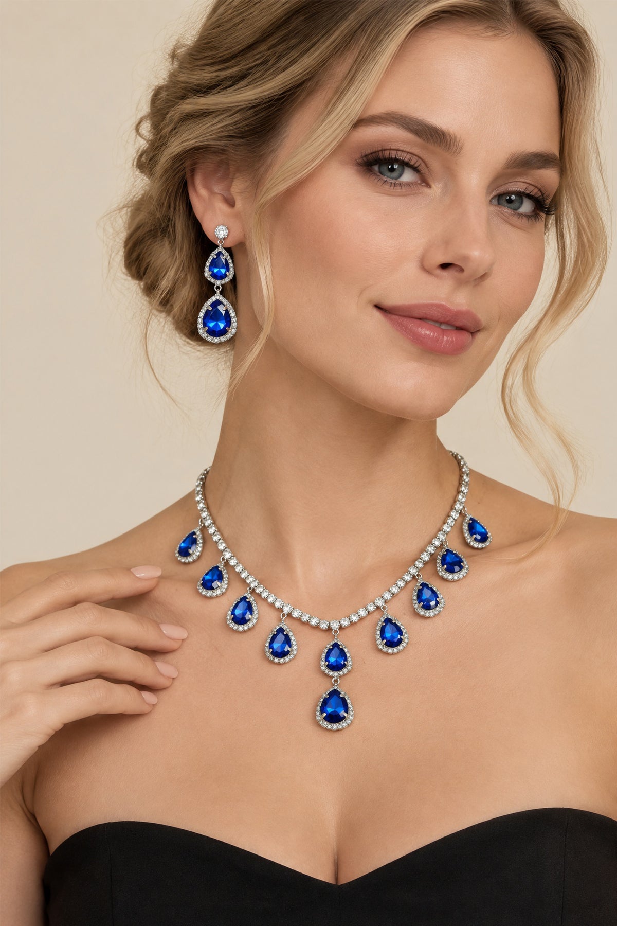 Model wearing the BOLODOO royal blue teardrop necklace and matching double-drop earrings