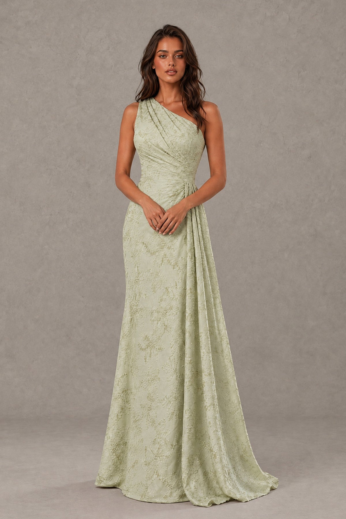 Front view of a BOLODOO sage green sleeveless one-shoulder floor-length gown with textured floral pattern