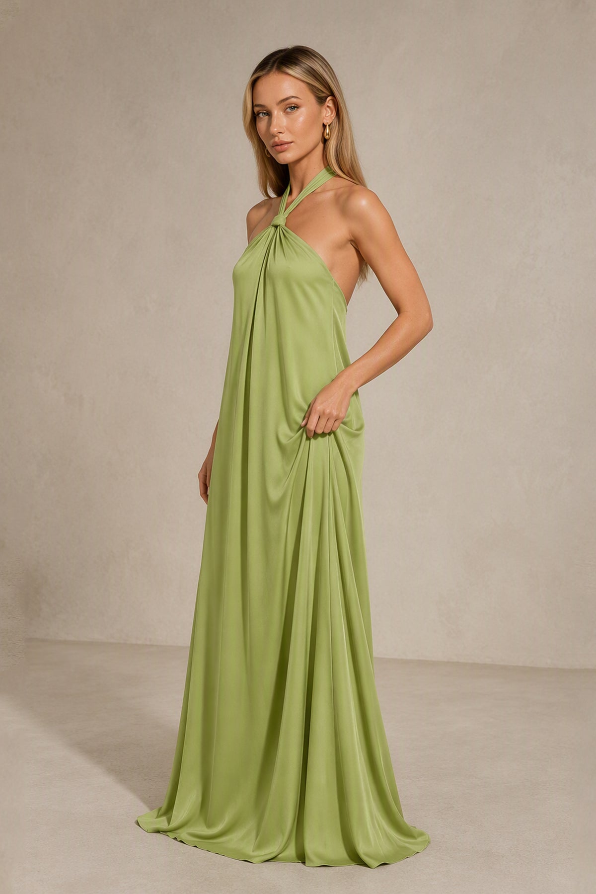 Back view of BOLODOO sage green halter satin bridesmaid dress showing the low open-back design