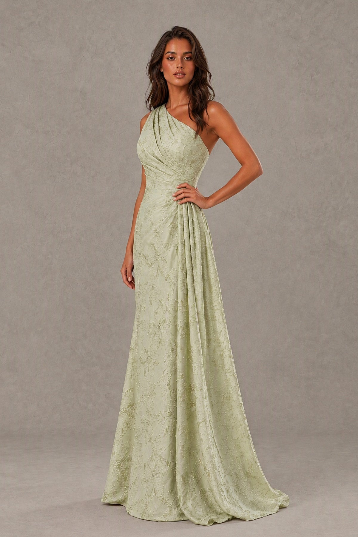 Back view of the BOLODOO sage green one-shoulder gown showing its back neckline and full-length skirt