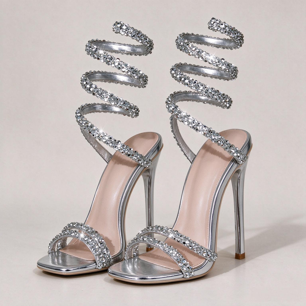 BOLODOO silver rhinestone spiral strap stiletto sandals, front three-quarter pair view