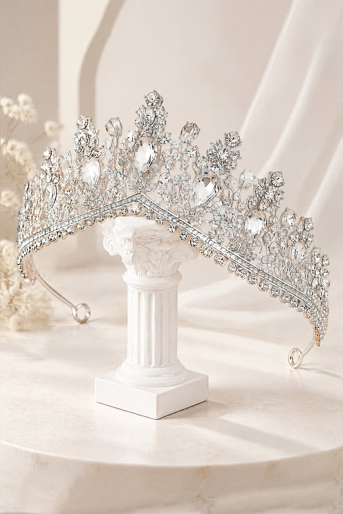 Angled view of BOLODOO QQ066 tiara with ornate scrollwork and curved band