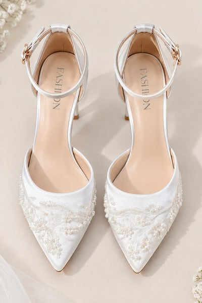 Front view of BOLODOO white pointed-toe bridal heels with pearl-like bead details and ankle straps