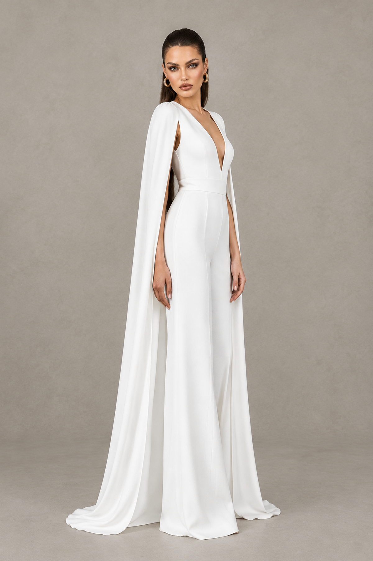 BOLODOO QQ081 white wide-leg bridal jumpsuit showing deep V neckline and cape panels, side view