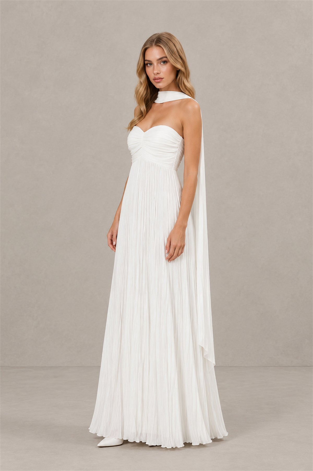 Side view of BOLODOO white bridal maxi dress showing flowing cape scarf