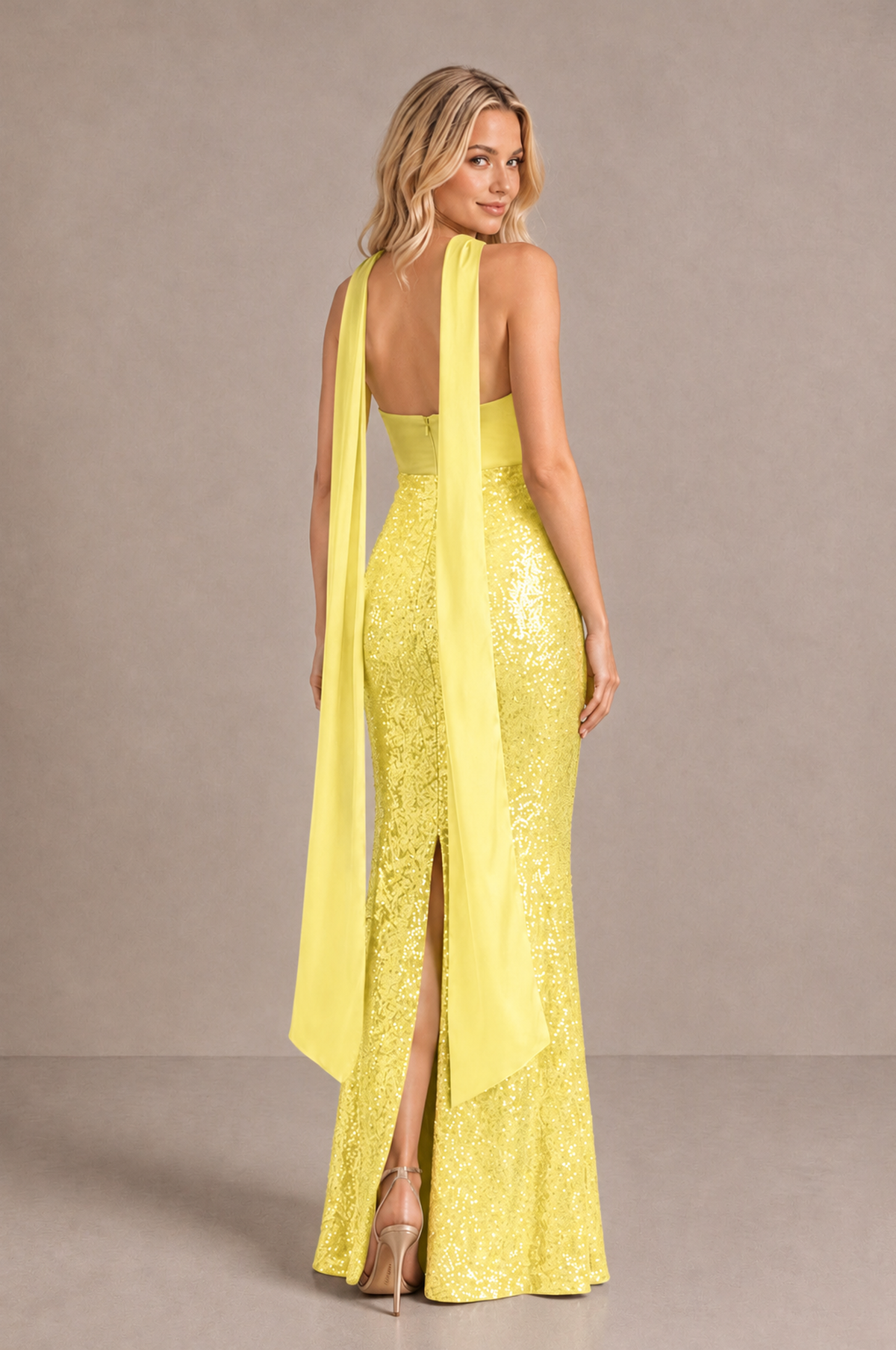 Back view of BOLODOO yellow evening dress showing exposed upper back, center-back slit and long scarf