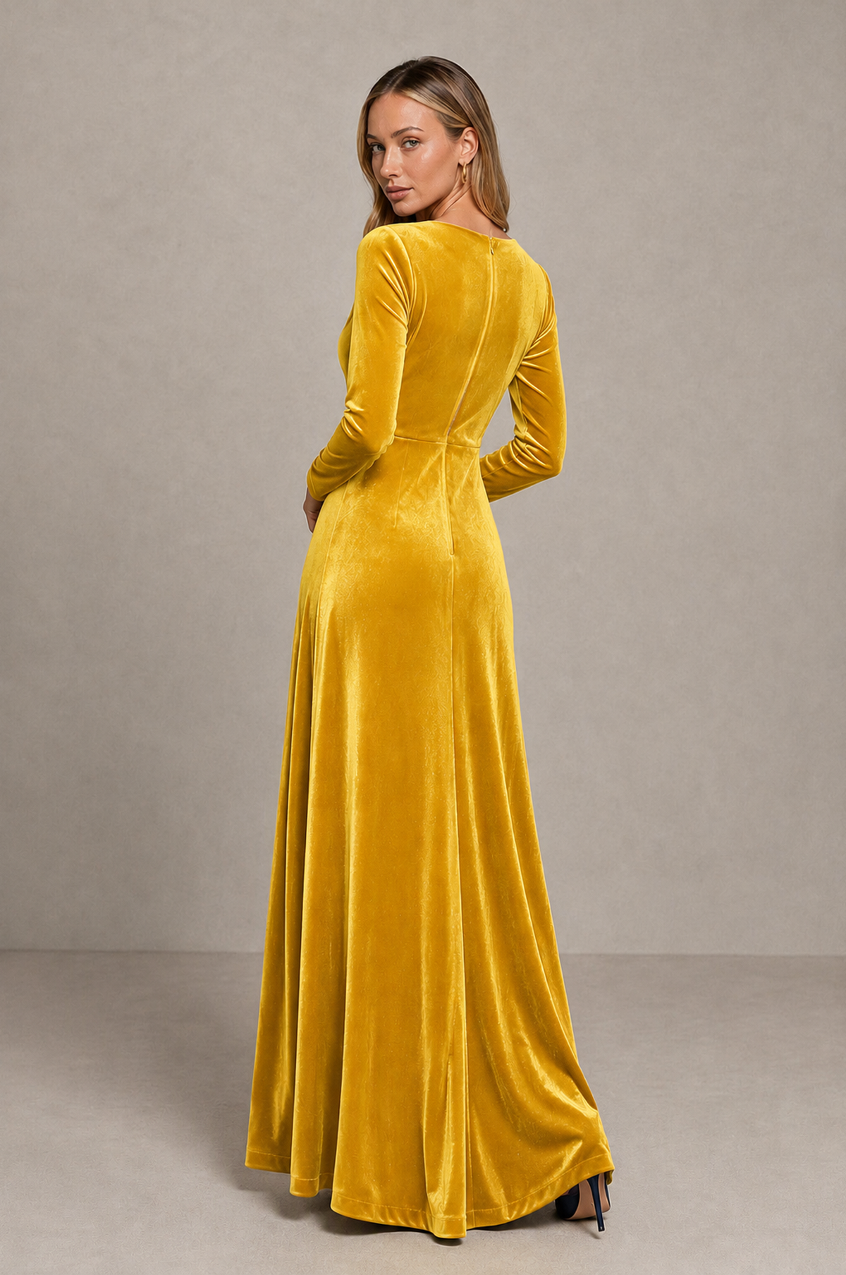 Back view of BOLODOO yellow velvet maxi dress showing covered back and floor-length skirt