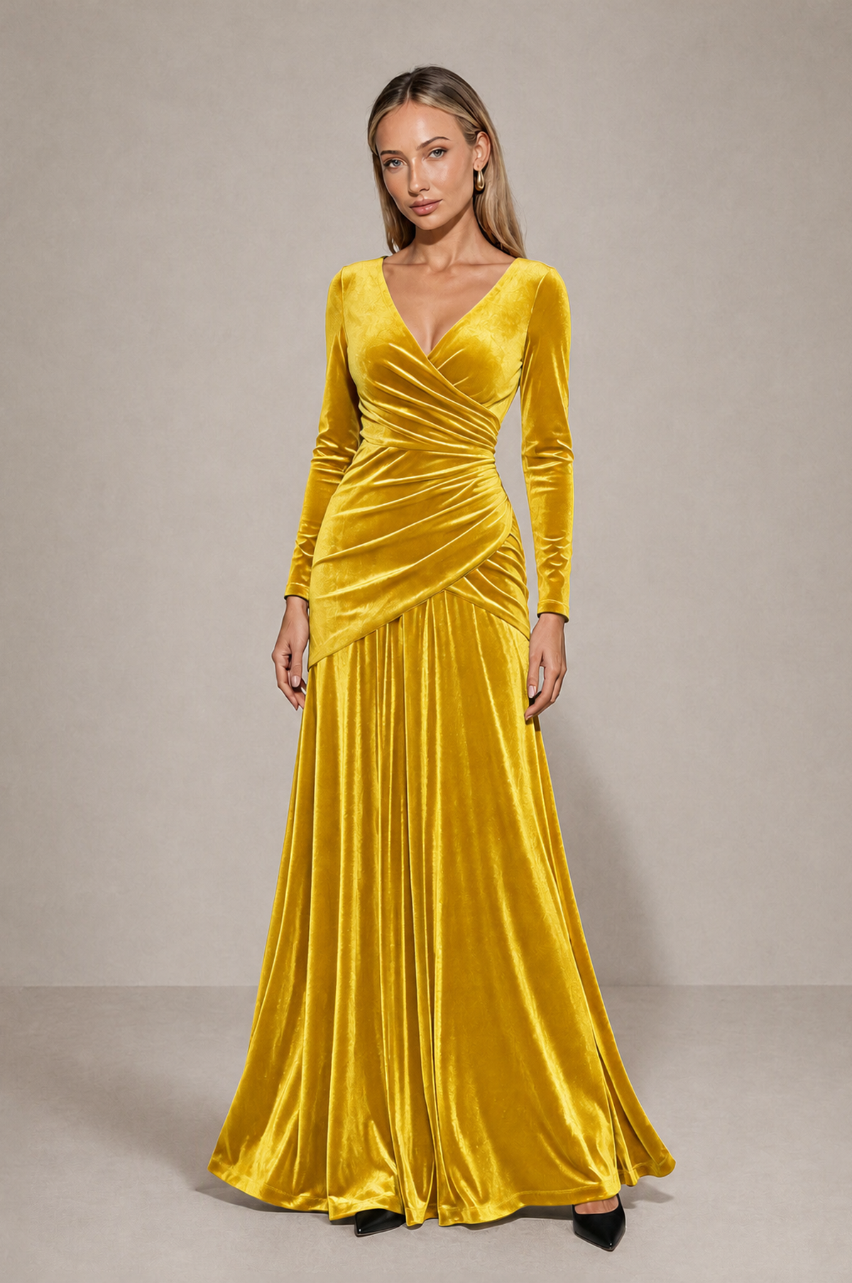 Front view of BOLODOO golden yellow floor-length velvet gown with crossover neckline and flowing skirt