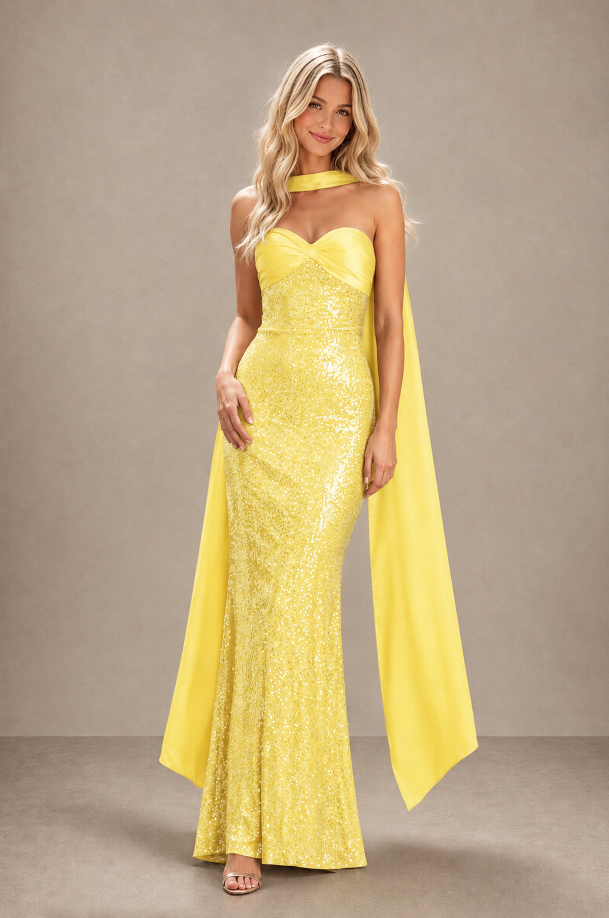 Front angled view of BOLODOO yellow floral-textured fitted evening gown with flowing scarf