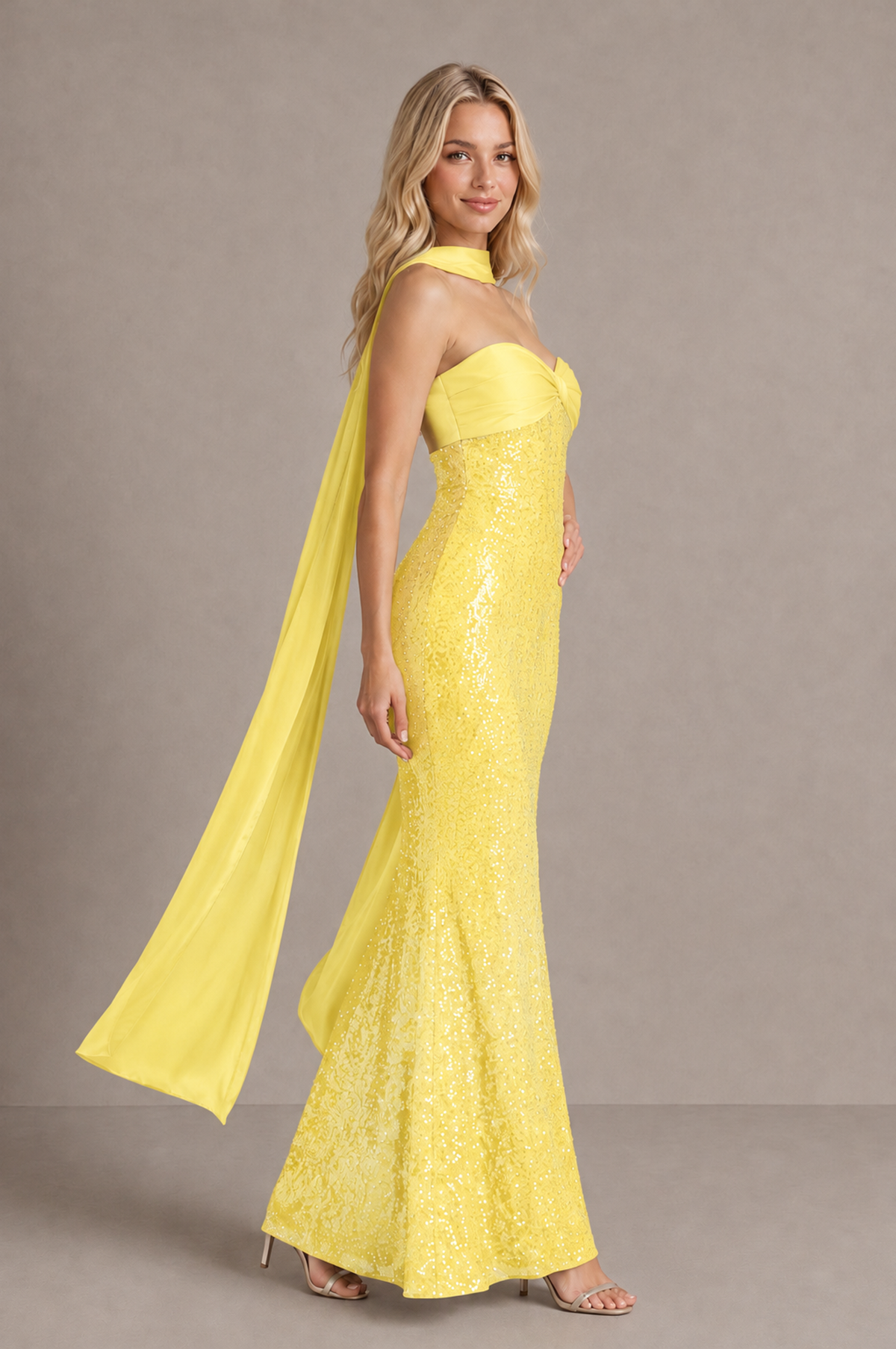 Side view of BOLODOO yellow floor-length sweetheart dress showing fitted silhouette and trailing scarf