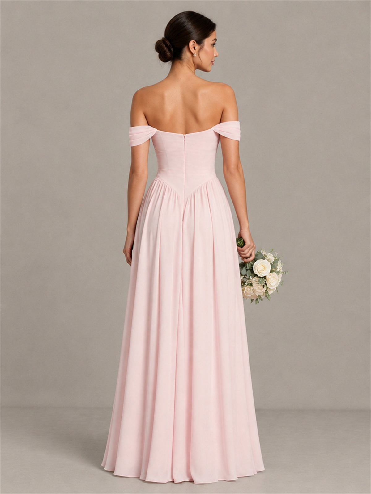 Blush pink chiffon bridesmaid gown with open back and zipper back view