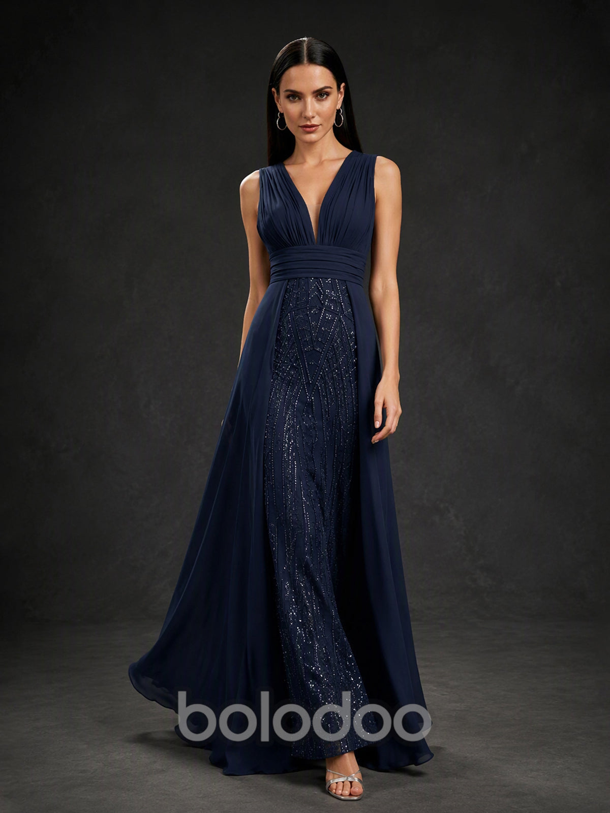 BOLODOO BX0003 navy blue formal gown - three-quarter front view showing V-neckline, beaded skirt panel and flowing chiffon overskirt | BOLODOO watermark