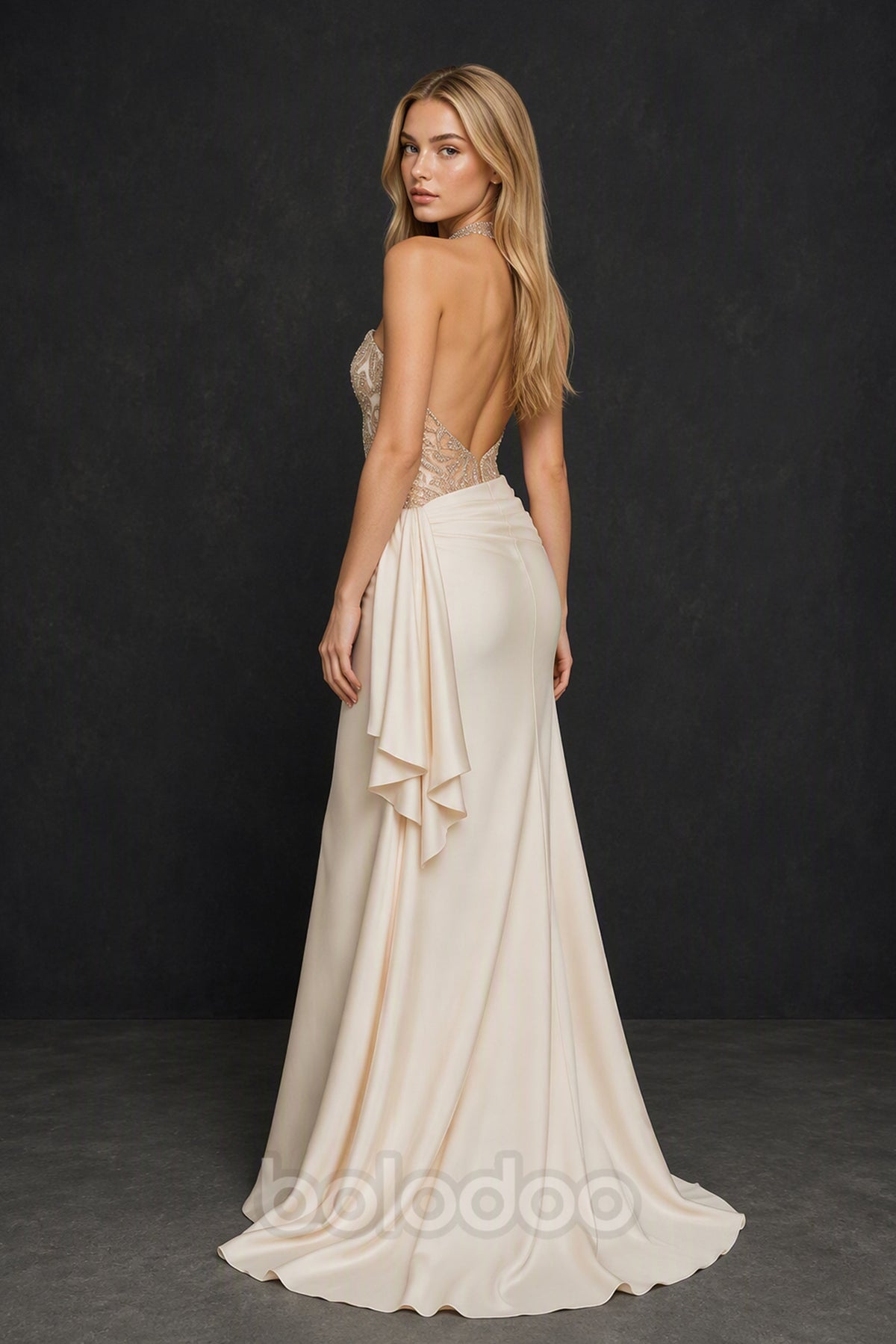 BOLODOO BX0017 champagne ivory strapless gown - back view showing deep open back, sheer illusion corset back and cascading satin ruffle drape with sweep train | BOLODOO watermark
