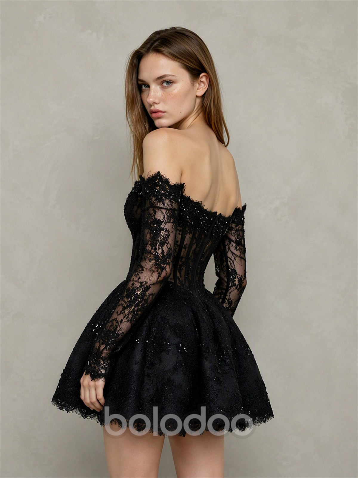BOLODOO BX0021 black off-shoulder lace mini dress - back view showing open back, sheer lace long sleeves with scalloped cuffs and full A-line glitter lace mini skirt | BOLODOO watermark