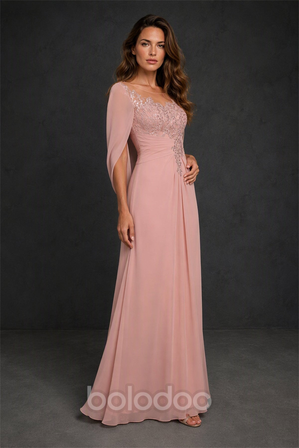 BOLODOO Blush Pink Illusion Lace Cape Sleeve Beaded Chiffon Gown - Front Three Quarter View | BOLODOO watermark