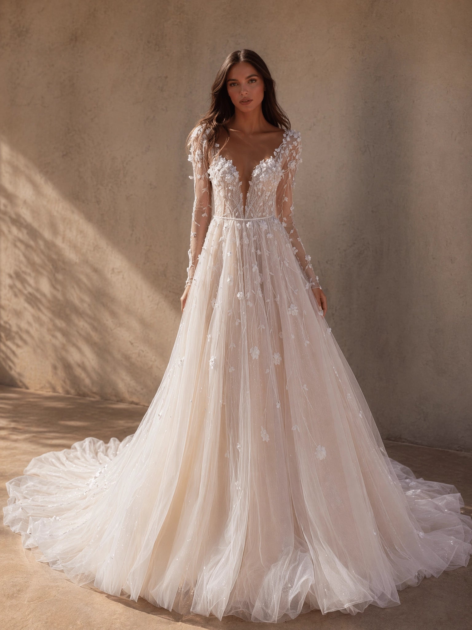 BOLODOO Ivory Deep V-Neck Sheer Long Sleeve 3D Floral Glitter Tulle A-Line Wedding Gown - full front view with cathedral train