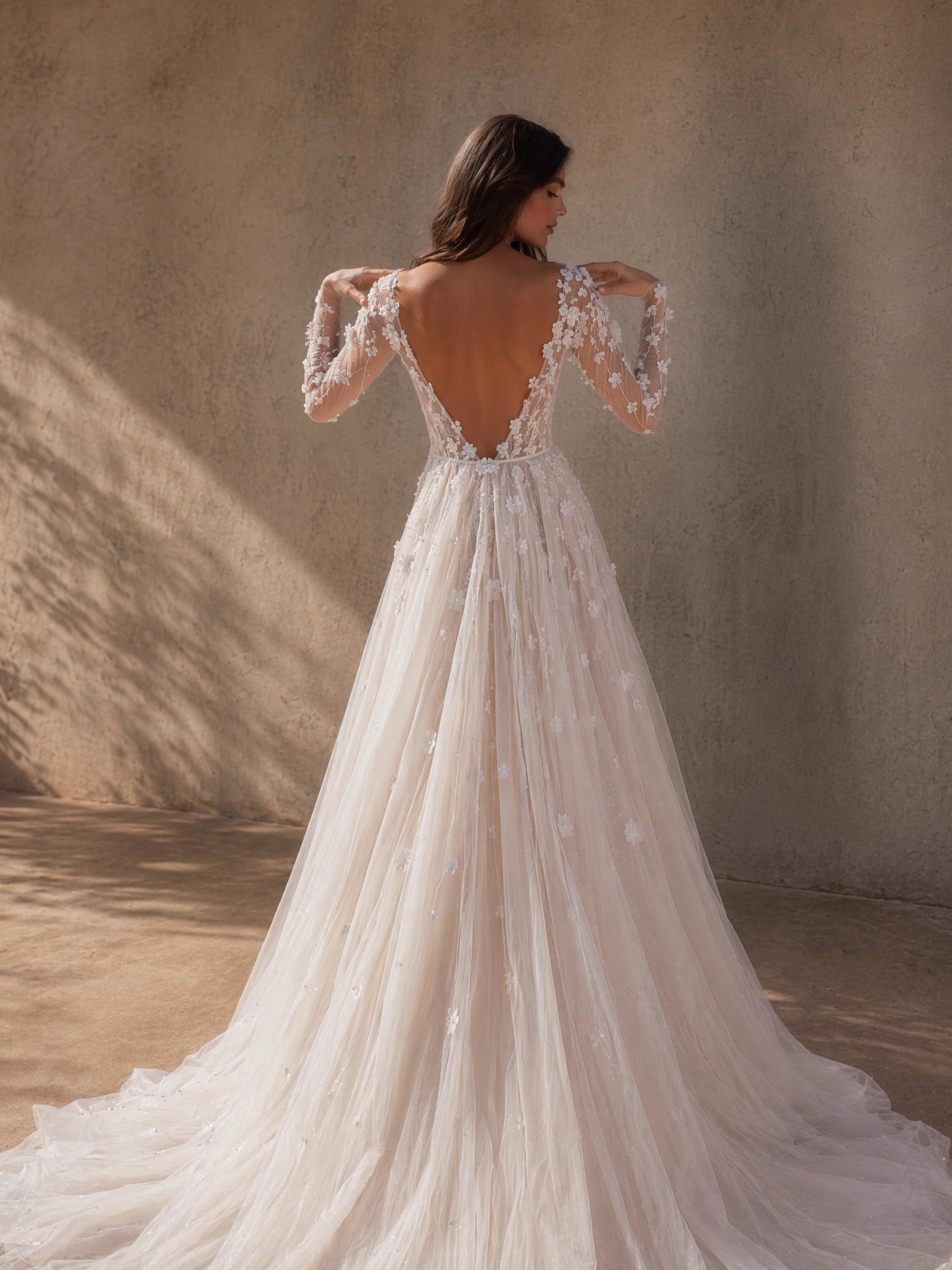 BOLODOO Ivory Deep V-Neck Sheer Long Sleeve 3D Floral Glitter Tulle A-Line Wedding Gown - back view deep V open back with cathedral train