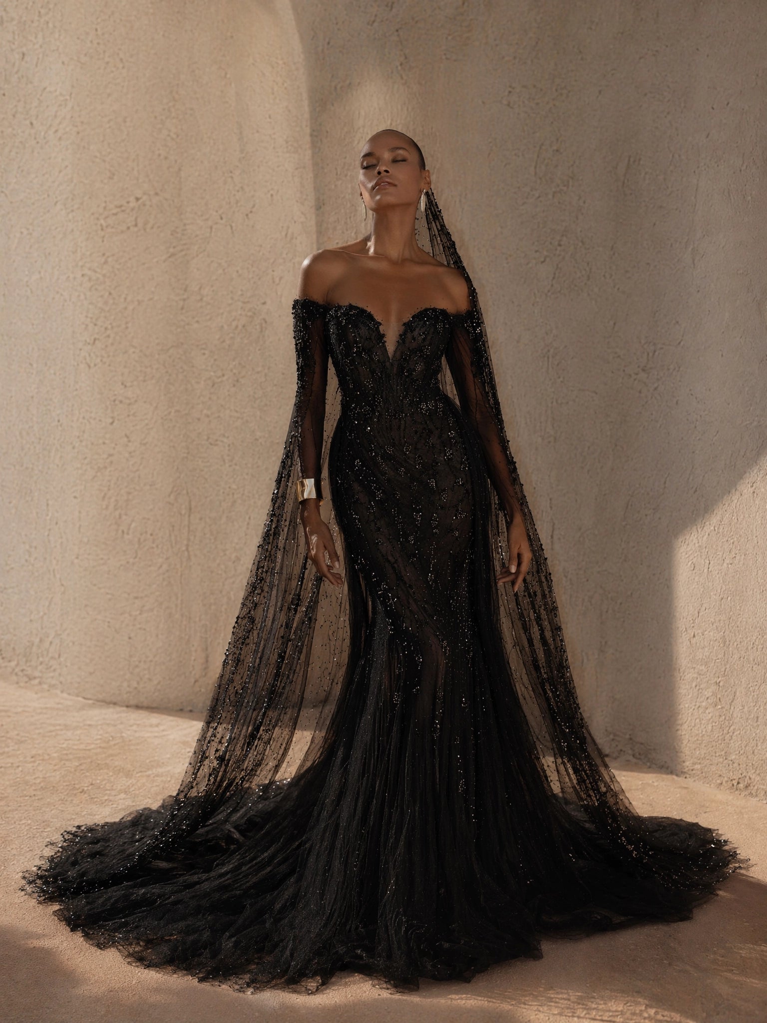 BOLODOO Black Off-Shoulder Sweetheart All-Over Sequin Crystal Beaded Mermaid Evening Gown - front view 2 with cape sleeves and sweeping train