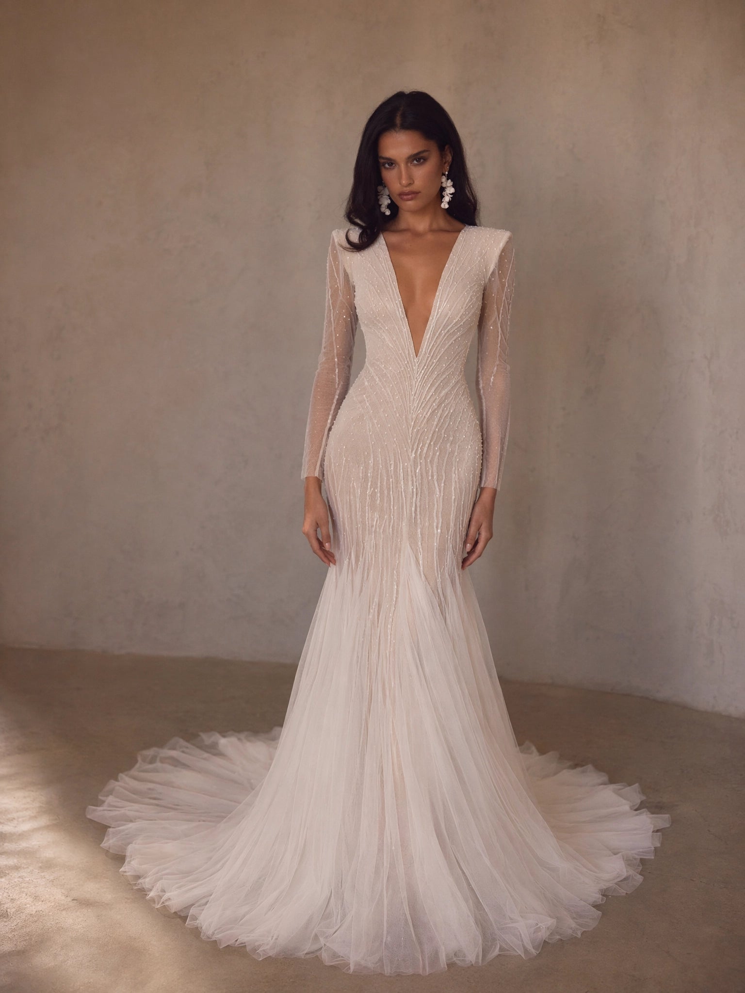 BOLODOO Ivory Deep V-Neck Long Sleeve Radiating Crystal Beaded Sheer Mermaid Wedding Gown - full front view with tulle train