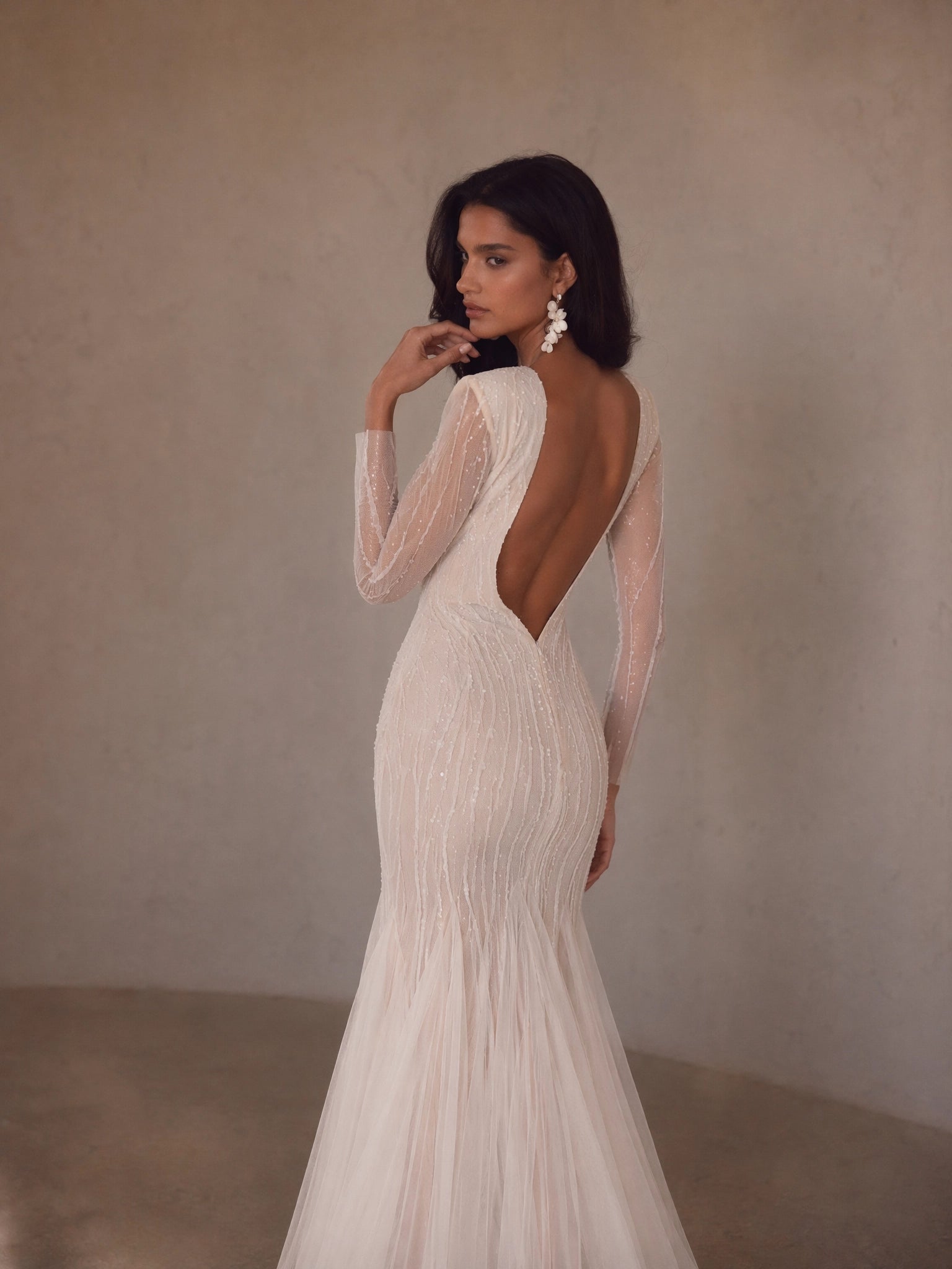 BOLODOO Ivory Deep V-Neck Long Sleeve Radiating Crystal Beaded Sheer Mermaid Wedding Gown - back view fully open U-back with tulle train